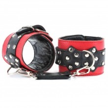 Красные наручники с черными проклепанными ремешками с пряжкой, длина 35 см.