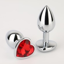 Серебристая анальная пробка «Оки Чпоки» с красным кристаллом в форме сердца, длина 7 см, Сима-ленд 5215672, цвет Серебристый, длина 7 см.